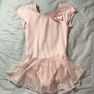 Girls light pink dance leotard with attached skirt